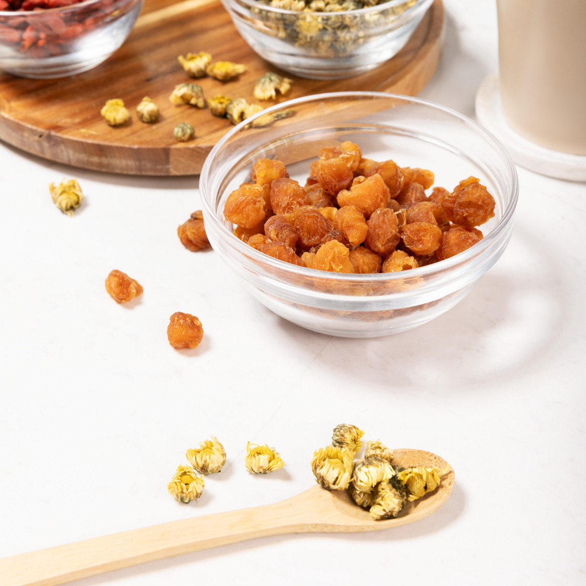 lifestyle image of Longan, Baby Chrysanthemum, and Goji Berry raw herbs