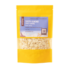 image of Root + Spring South Almond (Sweet Almond) featuring a clear window that displays the light beige almond flakes inside. The pouch has a lavender label with product details and is set against a plain white background.