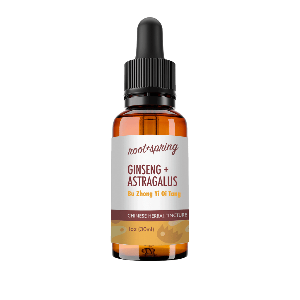 A 1 oz amber glass dropper bottle of Root+Spring Ginseng + Astragalus herbal tincture, featuring a white label with brown text and a black dropper cap, set against a plain white background.